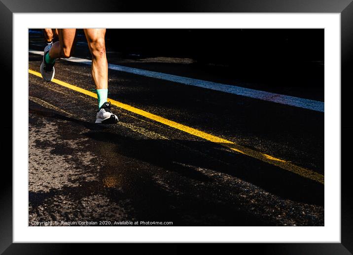 Running athletes have powerful quadriceps and calf muscles for running on asphalt. Framed Mounted Print by Joaquin Corbalan