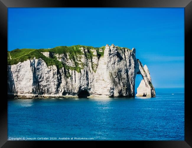 Natural rock arches and cliffs on the coast Sorrento and Capri, Italian islands with crystal clear waters where tourist boats crowd to photograph them in summer. Framed Print by Joaquin Corbalan