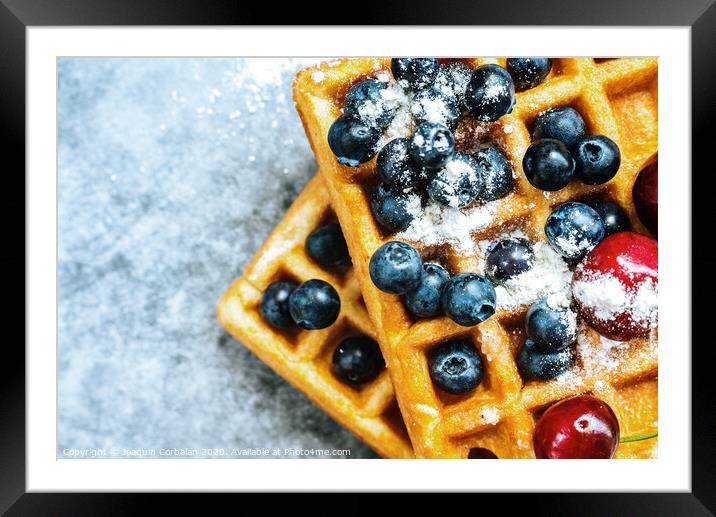 Close-up of a waffle with blueberries for breakfast during a vacation at a vegetarian restaurant. Framed Mounted Print by Joaquin Corbalan