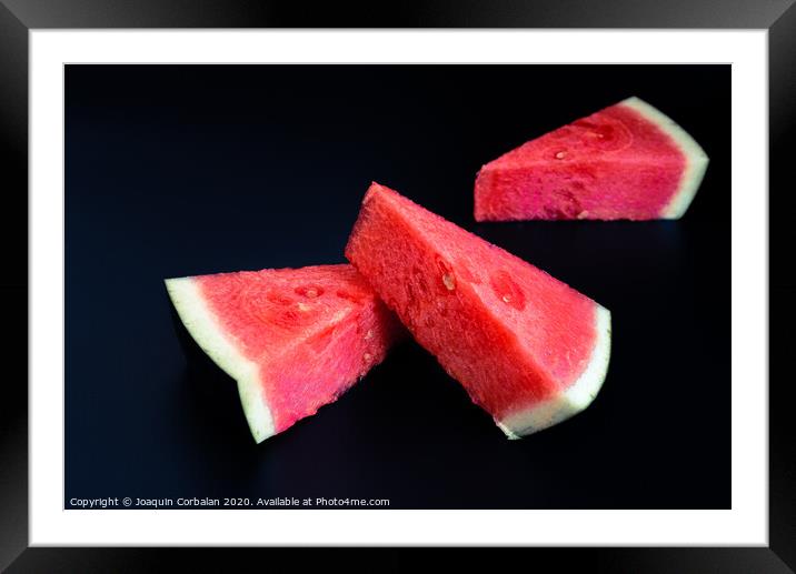 Three slices of watermelon stacked of intense color isolated on black background. Framed Mounted Print by Joaquin Corbalan