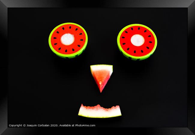 Composition of a funny face made with fruit, smile of a watermelon for summer diets. Framed Print by Joaquin Corbalan