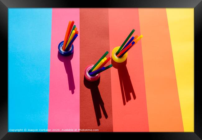 Plastic is a material for making recyclable colorful office supplies. Framed Print by Joaquin Corbalan