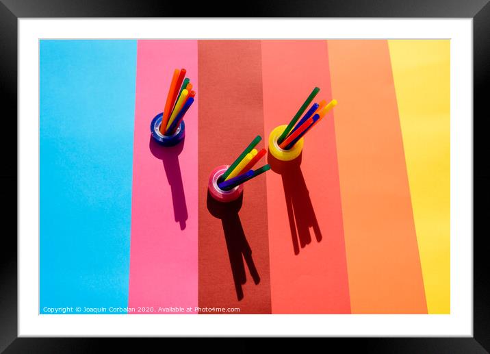 Plastic is a material for making recyclable colorful office supplies. Framed Mounted Print by Joaquin Corbalan