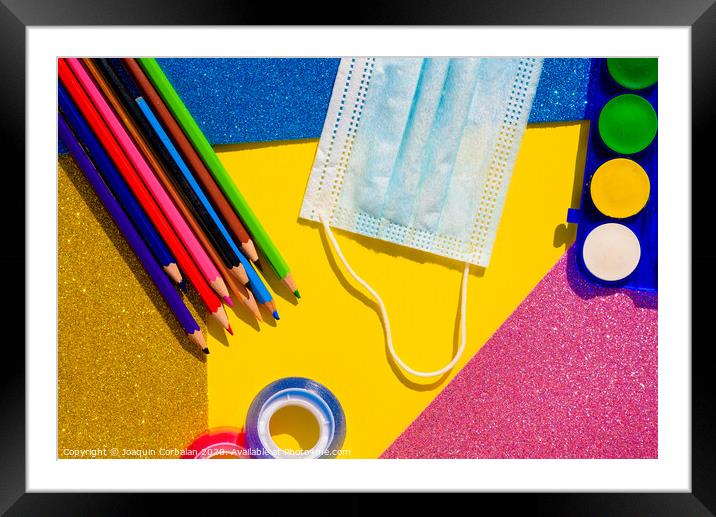 Creativity at school is developed with colorful materials and with the protection of a mask to avoid contagion, flat lay background. Framed Mounted Print by Joaquin Corbalan