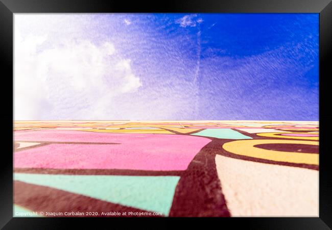 Blue sky urban background, with graffiti on a wall. Framed Print by Joaquin Corbalan