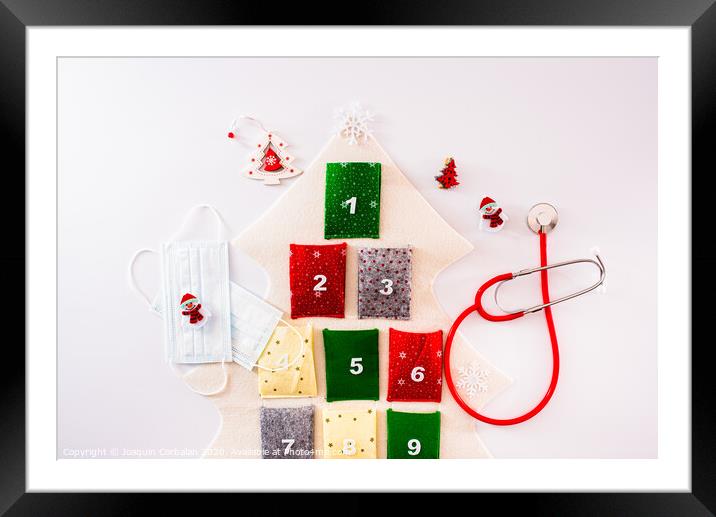 Traditional advent calendar protected with medical face masks, isolated on white background. Framed Mounted Print by Joaquin Corbalan