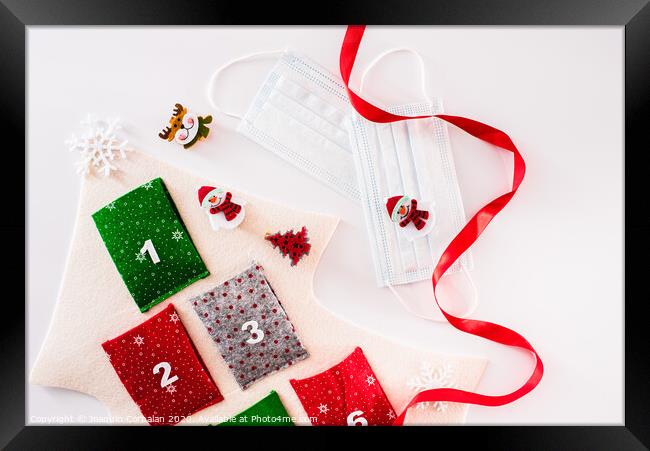 Christmas decoration isolated on white background with masks to avoid virus infections. Framed Print by Joaquin Corbalan