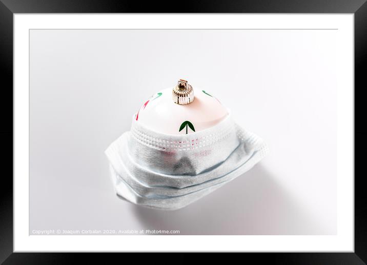 Christmas decoration isolated on white background with masks to avoid virus infections. Framed Mounted Print by Joaquin Corbalan