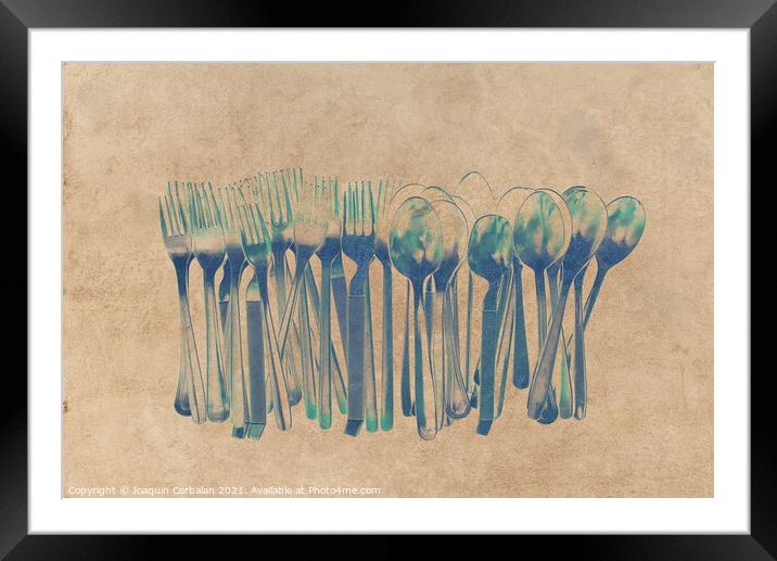 Cutlery forks and metal steel spoons for feeding, clean and isol Framed Mounted Print by Joaquin Corbalan