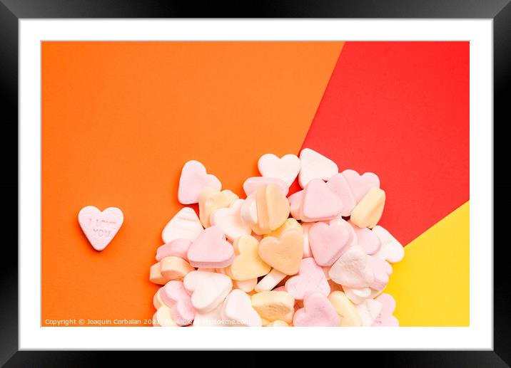 Word love in English on a candy heart, sweet image for Valentine Framed Mounted Print by Joaquin Corbalan