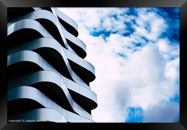 Residential building with a futuristic and minimalist design wit Framed Print by Joaquin Corbalan