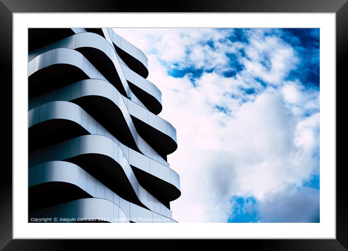 Residential building with a futuristic and minimalist design wit Framed Mounted Print by Joaquin Corbalan