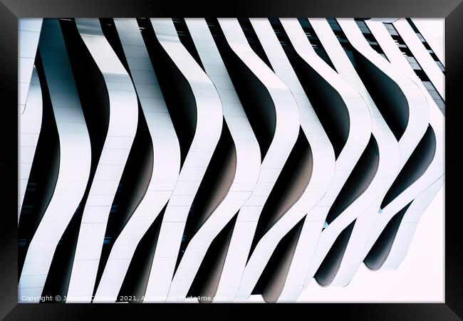 Modern architecture of a building with curves and straight lines Framed Print by Joaquin Corbalan