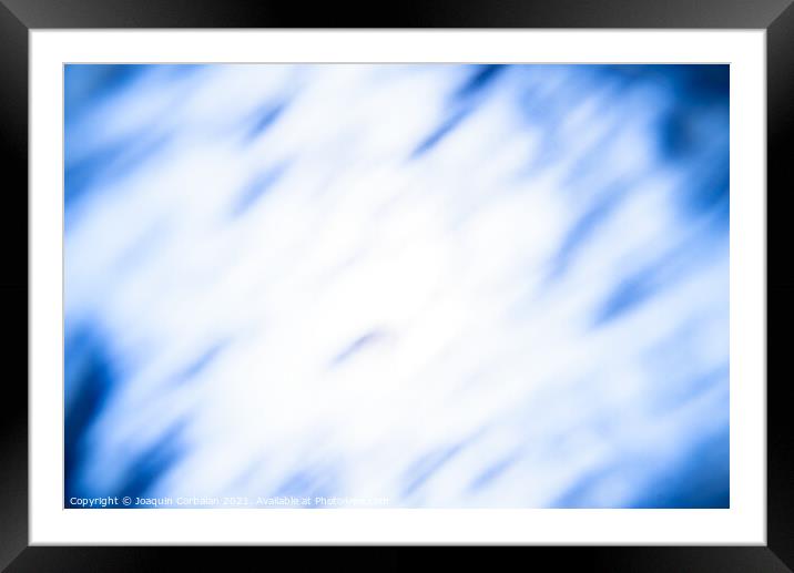 Diffuse abstract background with blue clouds on deep white. Framed Mounted Print by Joaquin Corbalan