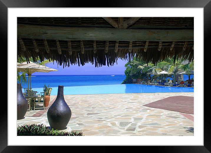 Infinity pool overlooking tropical ocean Framed Mounted Print by Simon Marshall