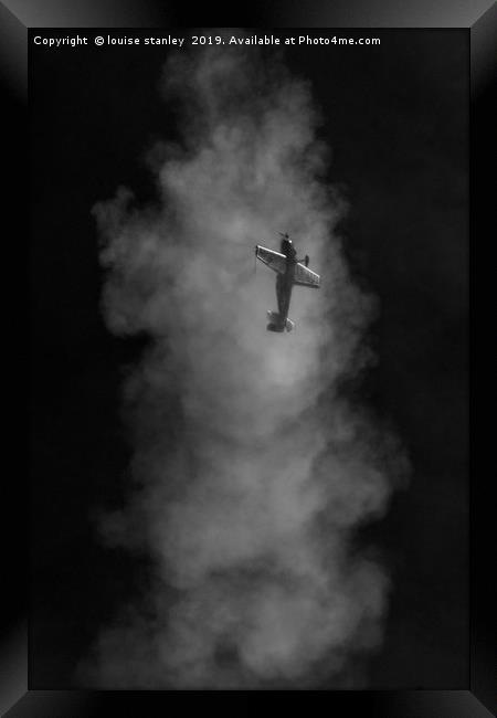  Aerobatic plane emerging from its smoke trail Framed Print by louise stanley