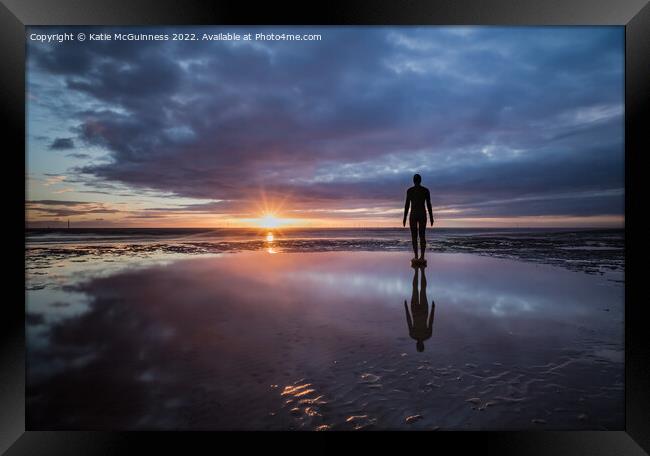 Moody sunset at Another Place on Crosby beach Framed Print by Katie McGuinness