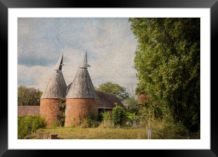 A farm in the countryside with an Oast House build Framed Mounted Print by David Wall