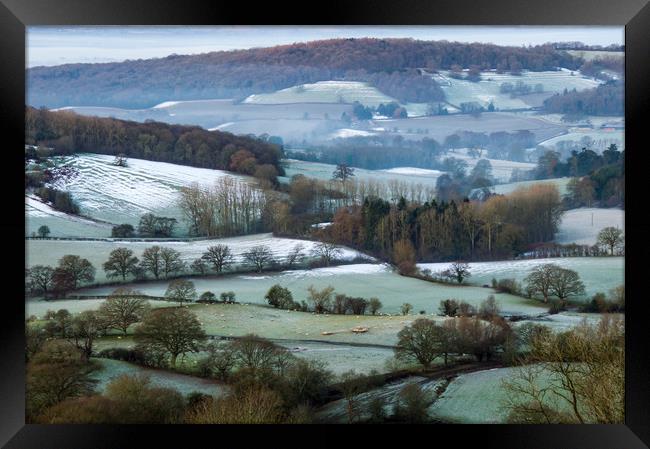 Looking across the fields and woods of an English  Framed Print by David Wall