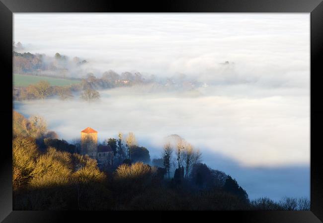 Looking down on Little Malvern Priory on a misty w Framed Print by David Wall