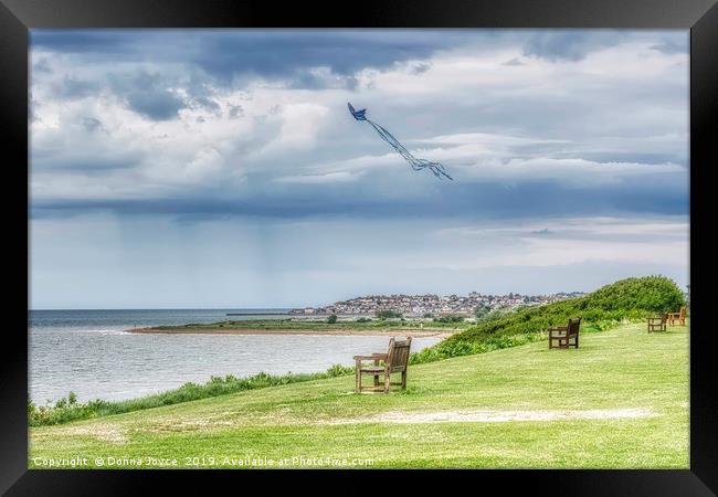 Kite flying over Tankerton slopes in Kent Framed Print by Donna Joyce