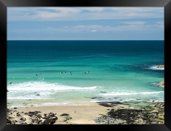 Surfers watching for waves at Little Fistral beach Framed Print by Tony Twyman