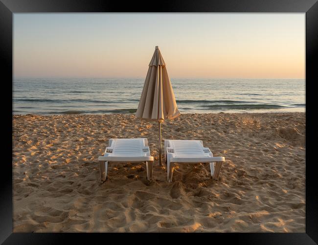 Sun beds on Falesia Beach in Portugal Framed Print by Tony Twyman