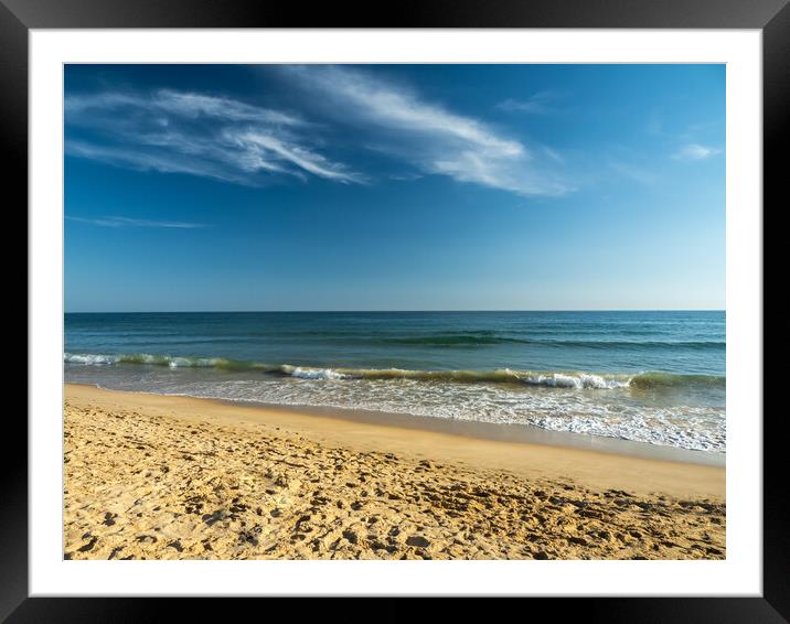 Waves lapping the shoreline of Falesia Beach  Framed Mounted Print by Tony Twyman