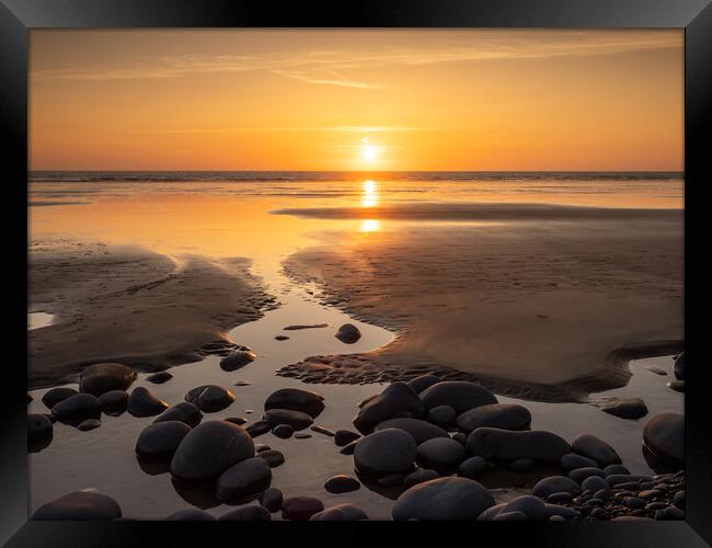 Pebble beach sunset Framed Print by Tony Twyman