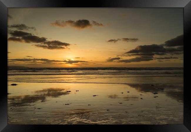 Reflective sunset at Westward Ho in Devon Framed Print by Tony Twyman