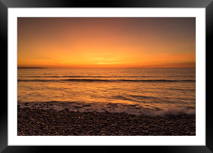Waves on the sunset lit shoreline at Westward Ho Framed Mounted Print by Tony Twyman