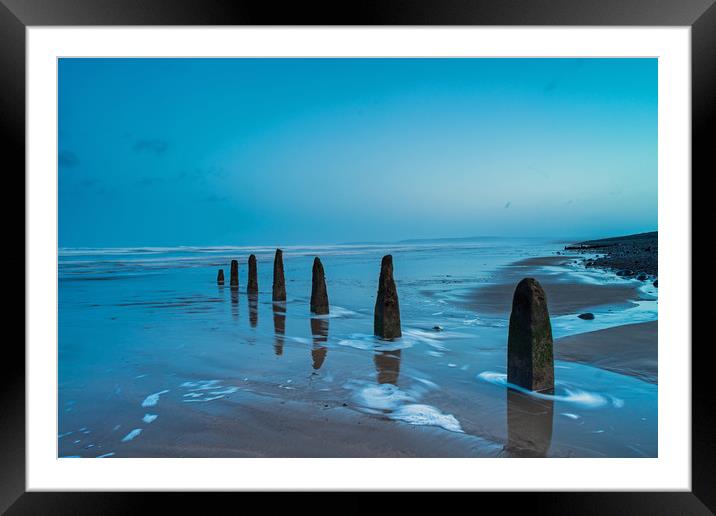 Weathered beach groynes at Dawn Framed Mounted Print by Tony Twyman