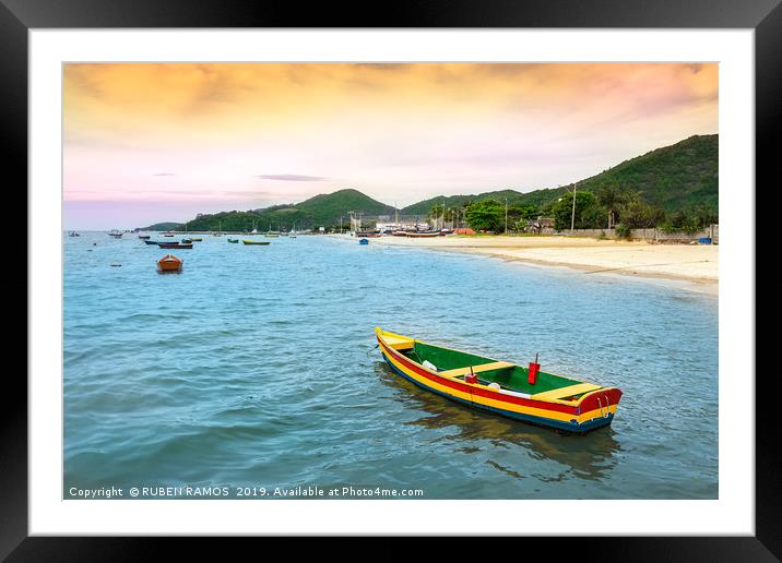 Colorful wooden fishing boat at the beach in Porto Framed Mounted Print by RUBEN RAMOS
