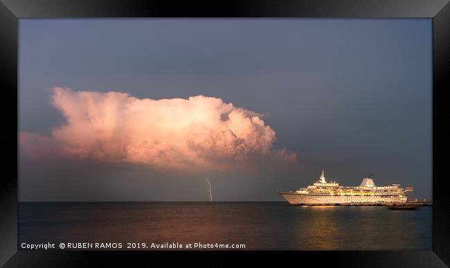 A thunderbolt hit the sea next to a ship. Framed Print by RUBEN RAMOS