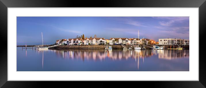 Sailboats moored on a peaceful harbor at night. Framed Mounted Print by RUBEN RAMOS