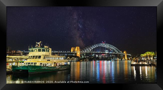 Panoramic view of the Sydney Harbour at a starry n Framed Print by RUBEN RAMOS