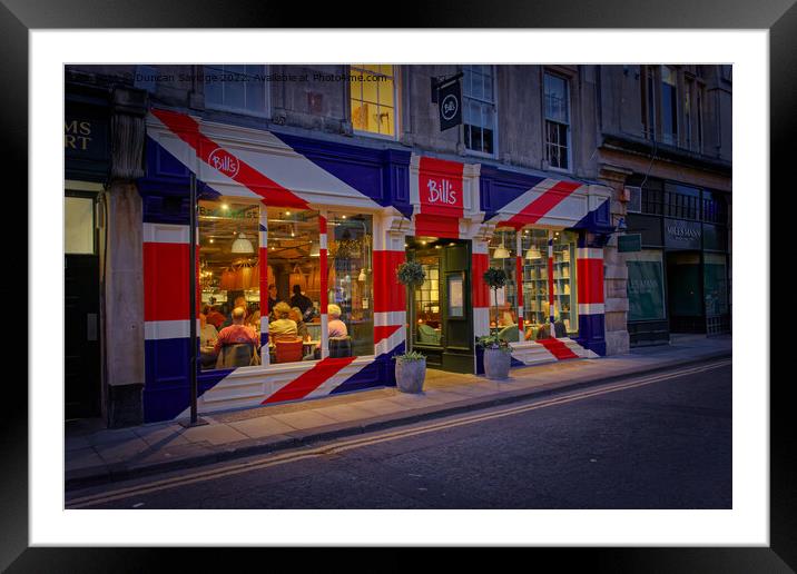 Bill's restaurant at dusk decorated in the Great Britain flag  Framed Mounted Print by Duncan Savidge