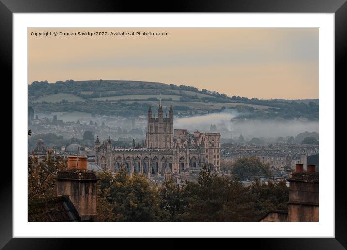 Moody early morning mist rising behind Bath Abbey Framed Mounted Print by Duncan Savidge