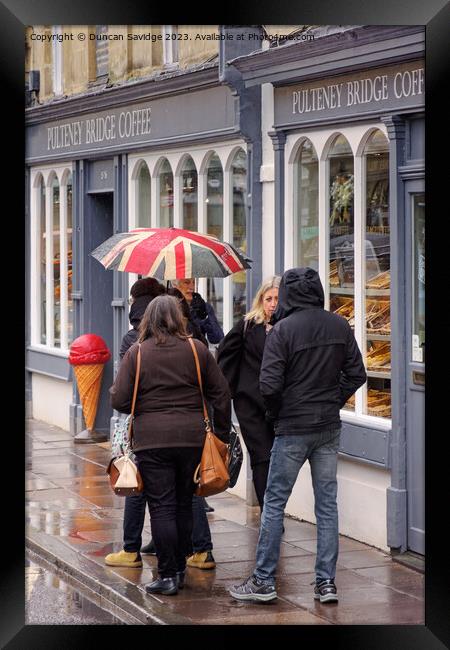 Pulteney Bridge coffee shop in the rain Framed Print by Duncan Savidge