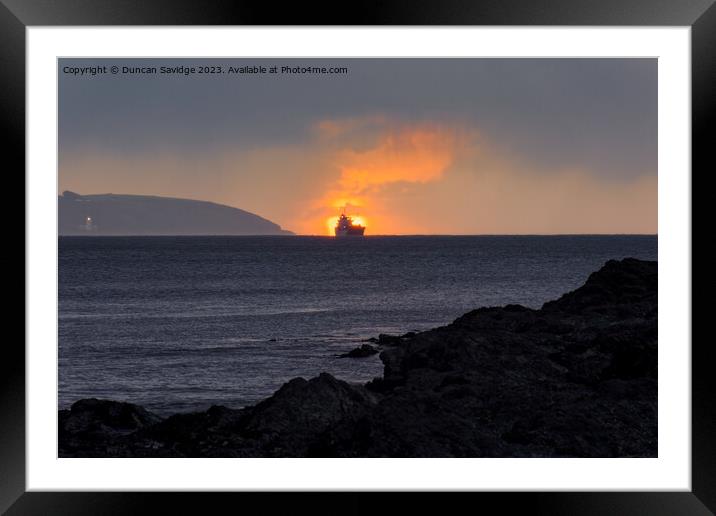 A moody sunrise at Maenporth Framed Mounted Print by Duncan Savidge
