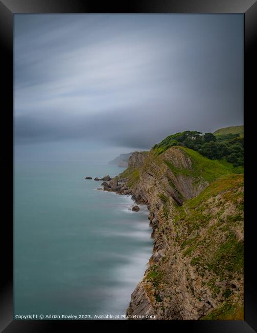 Jurassic Coast looking West from Lulworth Cove Framed Print by Adrian Rowley