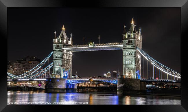 Tower Bridge at Night - London, United Kingdom.  Framed Print by Adrian Rowley