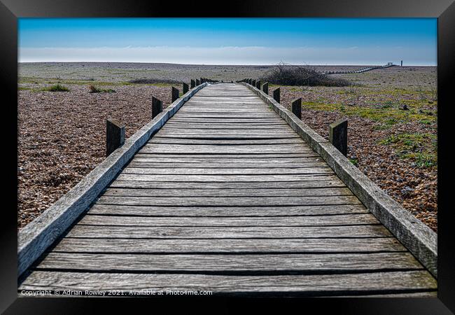 Dungeness walkway Framed Print by Adrian Rowley