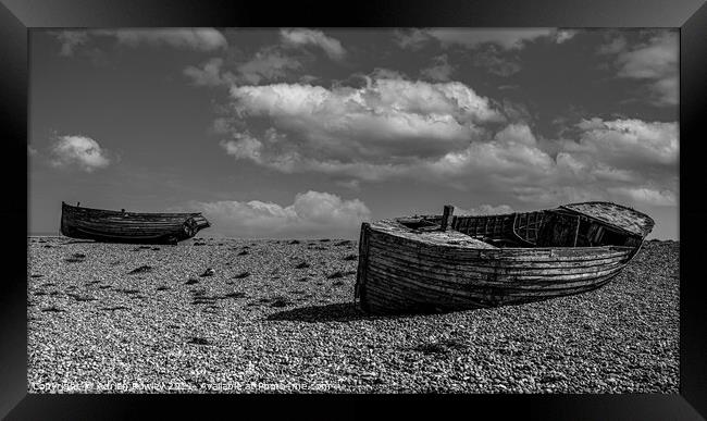 Abandoned fishing boats at Dungeness in Kent. Framed Print by Adrian Rowley