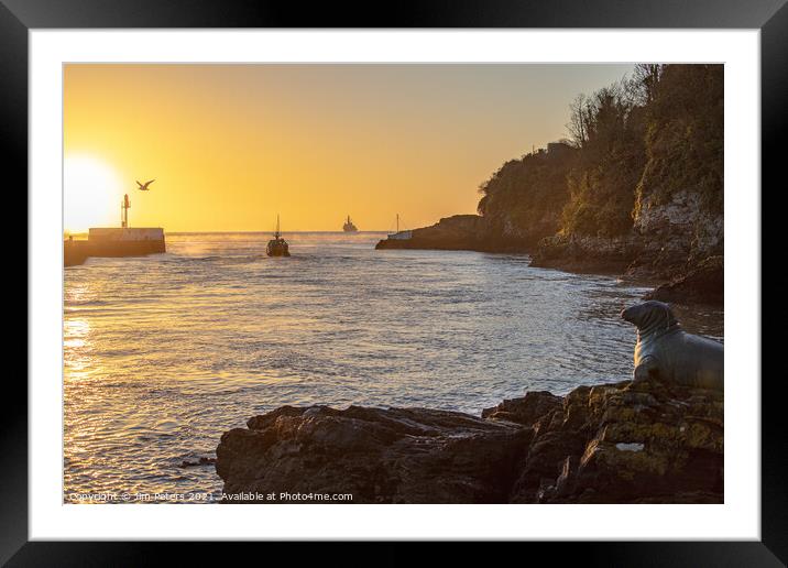 Sunrise over the Banjo Pier Looe with boats heading out to sea Framed Mounted Print by Jim Peters