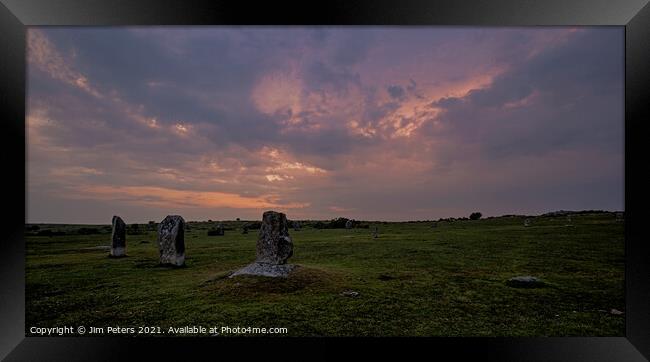 Moody sunset over the hurlers on Bodmin Moor Framed Print by Jim Peters