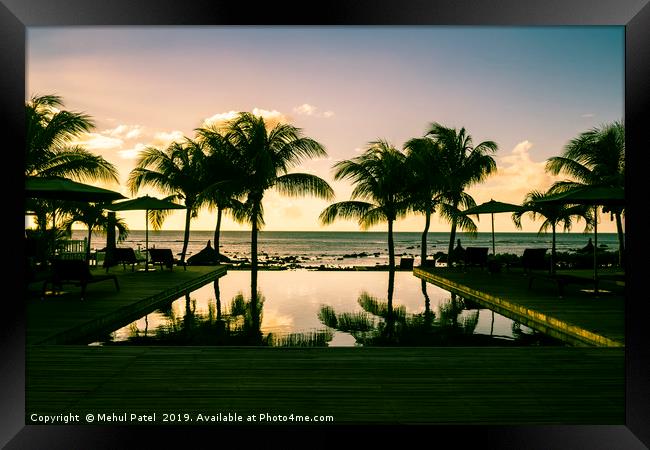 Infinity pool at resort in Mauritius during sunset Framed Print by Mehul Patel