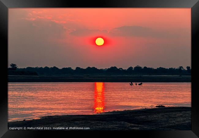 Sunsetting by river, Zambia, Africa Framed Print by Mehul Patel