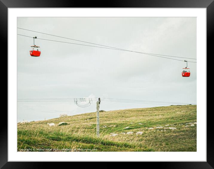 Red cable cars and goats on hill at the Great Orme Country Park above Llandudno, North Wales, UK Framed Mounted Print by Mehul Patel