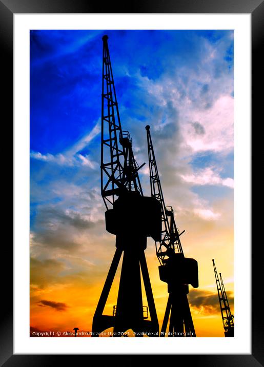 Port Cranes at London docklands - orange sunset Framed Mounted Print by Alessandro Ricardo Uva